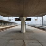 a train station with a sign