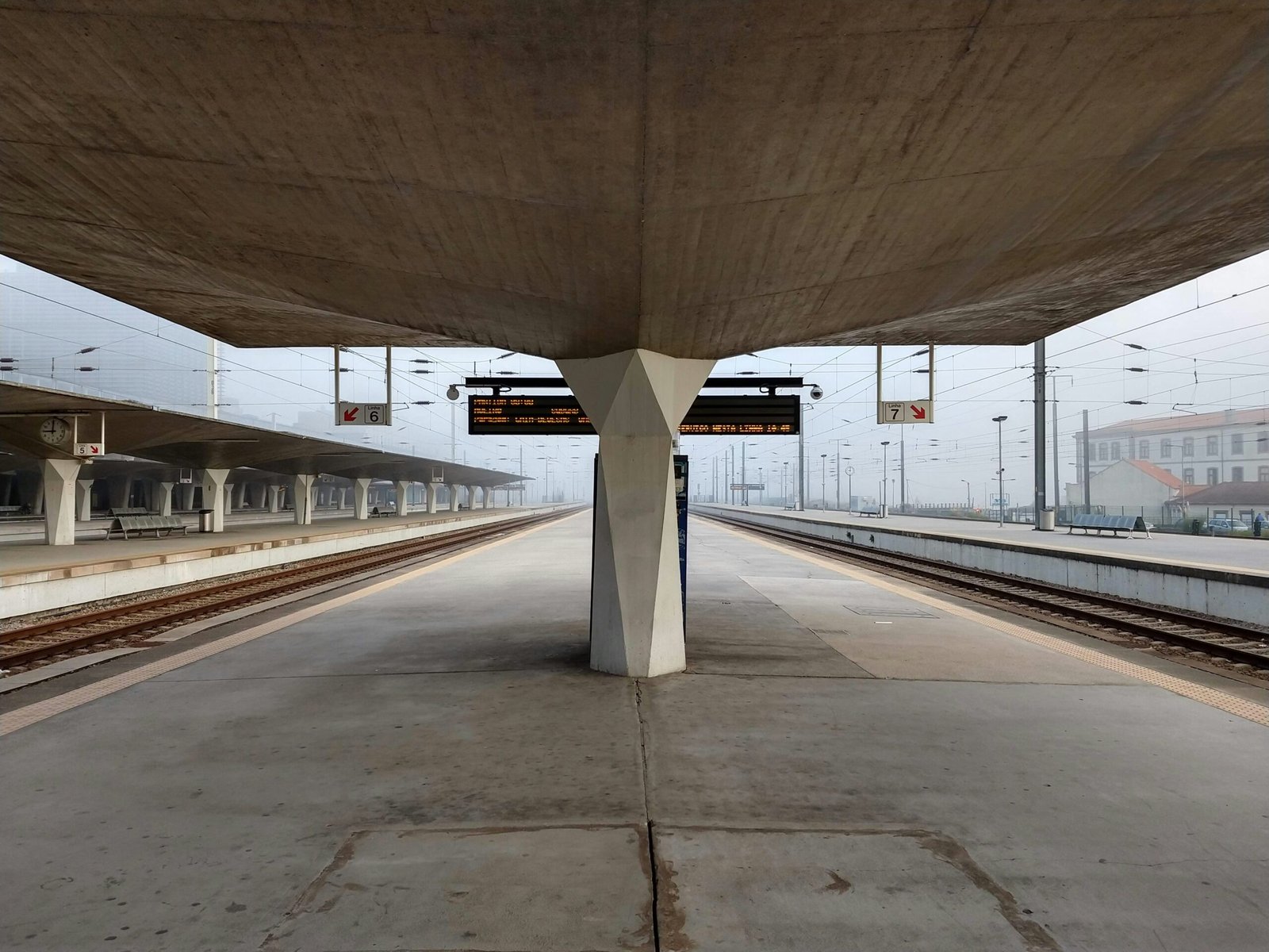 a train station with a sign